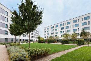 an apartment building with a park in front of it at Residence Inn by Marriott Munich Ostbahnhof in Munich