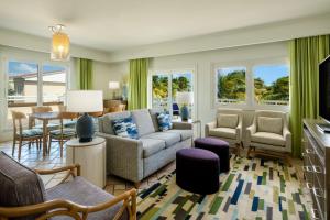 a living room with a couch and chairs and a table at Marriott St. Kitts Beach Club in Frigate Bay