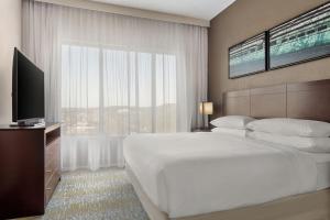 a bedroom with a large bed and a large window at Delta Hotels by Marriott Bristol in Bristol +19 photos