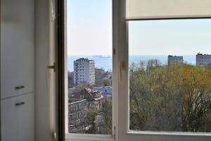 a view of a city from a window at Horyzont by 3City Rentals in Gdynia