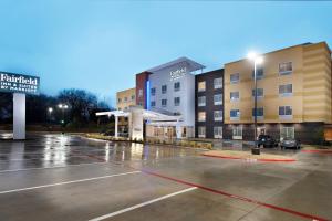 an empty parking lot in front of a hotel at Fairfield Inn & Suites by Marriott Tyler South in Tyler