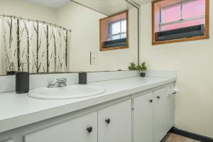 a bathroom with a sink and a mirror at Circle Overlook-Downtown Apartment Stay in Sebring +46 photos