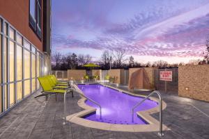 a swimming pool on top of a building at SpringHill Suites by Marriott Jackson in Jackson