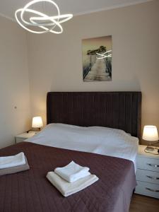 Postel nebo postele na pokoji v ubytování Izi Palace Deluxe StudioB1