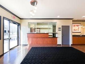 an empty lobby with a reception desk and a door at Blaine Town Inn & Suites in Blaine