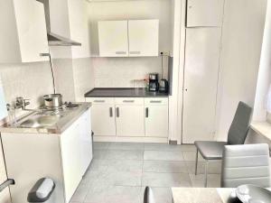 Kuchyň nebo kuchyňský kout v ubytování Citynahe 2-Zimmer Wohnung