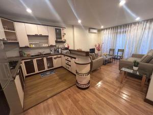 a living room with a kitchen and a living room with at Newly Riverbank suites 408 in Kuching