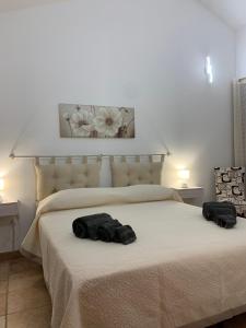 Ένα ή περισσότερα κρεβάτια σε δωμάτιο στο casa vacanza V&G