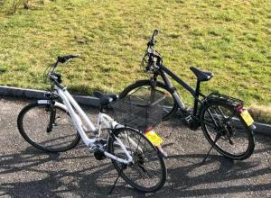 two bikes parked next to each other on a street at Studio à Courrendlin in Courrendlin