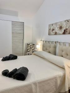 Ένα ή περισσότερα κρεβάτια σε δωμάτιο στο casa vacanza V&G