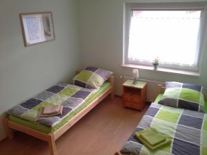 Een bed of bedden in een kamer bij Abelia Gästehäuser