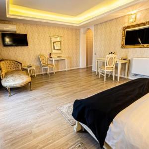 TV a/nebo společenská místnost v ubytování Grand Hotel Baroc