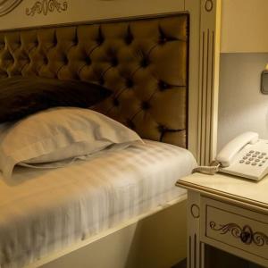 Postel nebo postele na pokoji v ubytování Grand Hotel Baroc