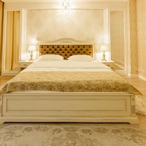 Postel nebo postele na pokoji v ubytování Grand Hotel Baroc