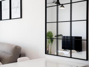 Televízia a/alebo spoločenská miestnosť v ubytovaní Small Oasis 2375 Sea View