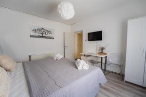 Postel nebo postele na pokoji v ubytování Silver Room