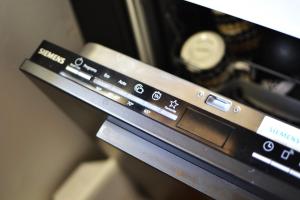 a close up of the control panel of an oven at One-bedroom apartment in the center of Saariselkä in Saariselka +18 photos
