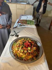 a table with a plate of food on a table at Sina Star Camp in Nuweiba