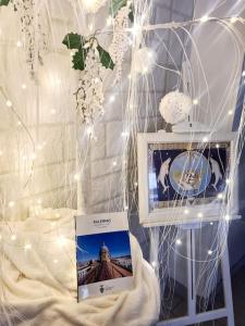 a table with a picture of a building with lights at Energy Home in Palermo