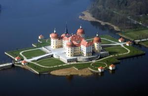 an island with a castle in the middle of the water at Ferienhaus Dr. Müller in Meißen