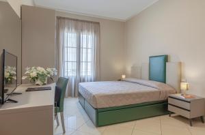 Ένα ή περισσότερα κρεβάτια σε δωμάτιο στο Ghibli Hotel