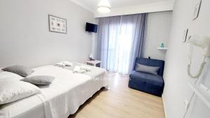 Posteľ alebo postele v izbe v ubytovaní Vasileiadou Coastal Rooms