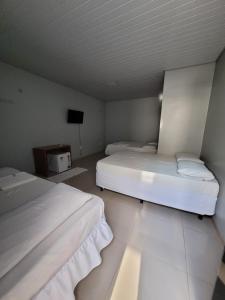 Postel nebo postele na pokoji v ubytování POUSADA ALÉM-K