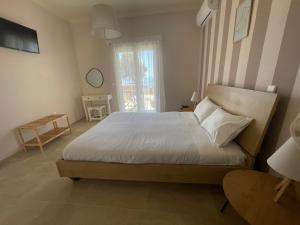 Postel nebo postele na pokoji v ubytování Tsanta house