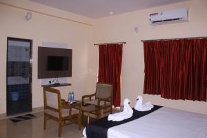 Μια τηλεόραση ή/και κέντρο ψυχαγωγίας στο CHETAN INN HOTEL