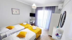 Posteľ alebo postele v izbe v ubytovaní Vasileiadou Coastal Rooms