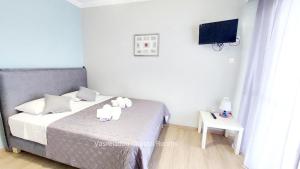 Posteľ alebo postele v izbe v ubytovaní Vasileiadou Coastal Rooms