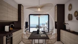 a kitchen with a table with chairs and a large window at Seaview House Cala Gonone in Cala Gonone