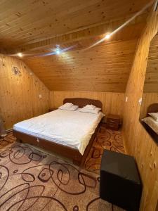 Postel nebo postele na pokoji v ubytování Made in Yaremche