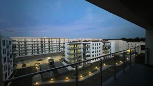 a view of a city at night with buildings at Granata Apartments in Lublin