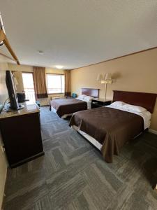 Ένα ή περισσότερα κρεβάτια σε δωμάτιο στο Green Valley Motel Winston Salem +16 φωτογραφίες