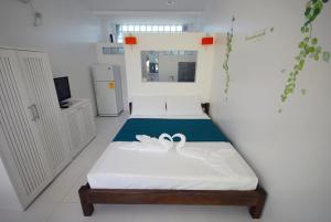 Postel nebo postele na pokoji v ubytování ClubBoracay Apartelle