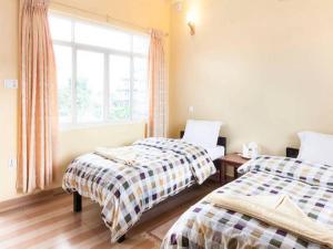 Un pat sau paturi într-o cameră la Placid Valley Lodge