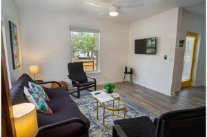 a living room with a couch and a table at Charming 4BR2BA Only 5 mins Downtown Riverwalk in San Antonio