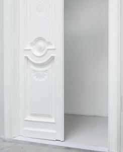 a white door with a window in a room at La Maison Boheme by Fra Cielo e Mare in Cagliari