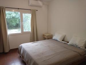 En eller flere senge i et værelse på Coneta, casa de Dios