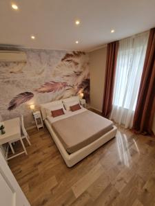 Ένα ή περισσότερα κρεβάτια σε δωμάτιο στο FLORA HOUSE