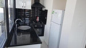 Η κουζίνα ή μικρή κουζίνα στο Çeşme holiday homes +89 φωτογραφίες