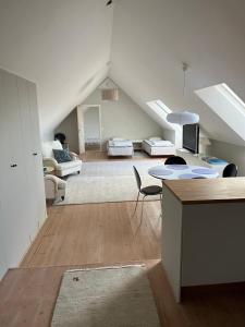 a kitchen and living room with an attic at Ingridgården in Båstad