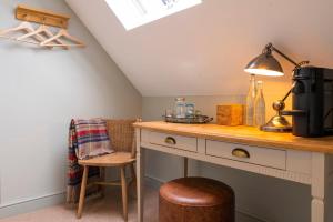 a kitchen with a desk and a chair at The Bottle & Glass Inn - Deluxe Room - Room 3 in Henley on Thames