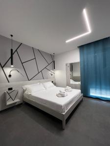 Ένα ή περισσότερα κρεβάτια σε δωμάτιο στο B&B A due passi dal mare