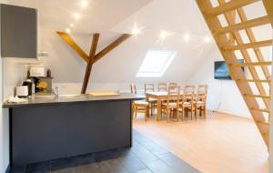 a kitchen and dining room with a table and chairs at Stay and Work Apartment - 8 single beds - Garage in Bedburg Hau