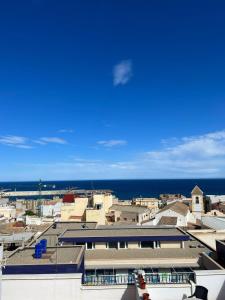 a view of a city with the ocean in the background at Ático duplex con Vista Mar y Terraza Privada a 200m de la playa hasta 6 personas in Garrucha