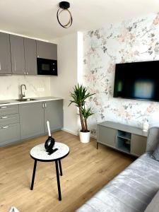 a living room with a couch and a table at Zagreb City Center Apartments LUX in Zagreb