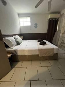 Letto o letti in una camera di Le Ti Dauphin plage Anse a L'âne