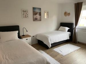 Uma cama ou camas num quarto em Apartma Luka